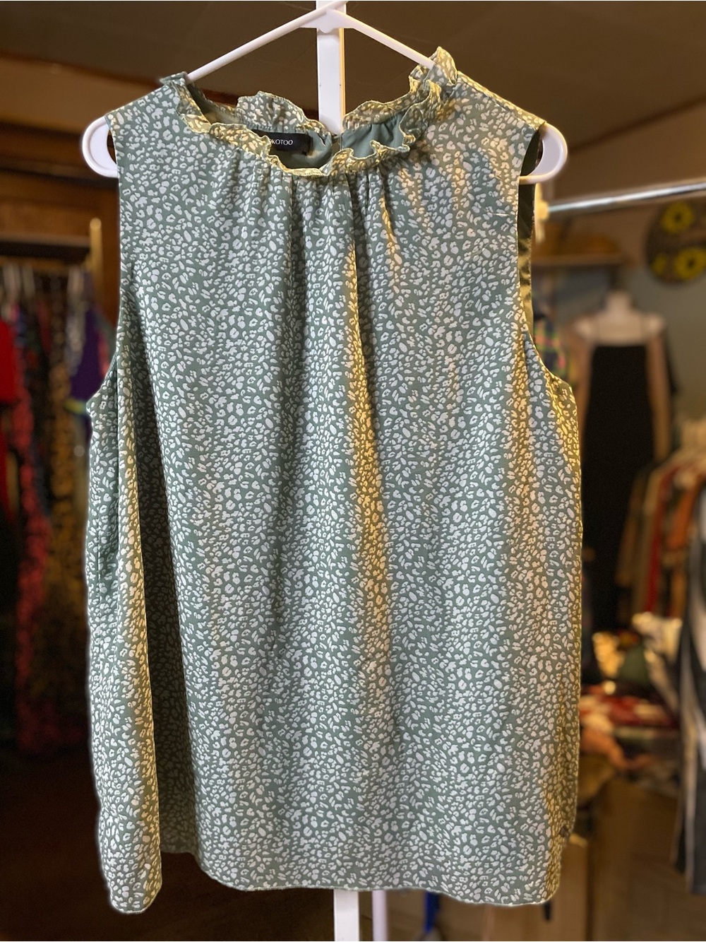 Sleeveless Ruffle-Neck Blouse in Sage with White Print